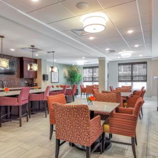 A modern dining area with comfortable seating and ambient lighting.