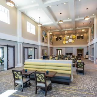 A modern and spacious lounge area with stylish seating and decor.