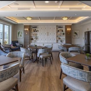A modern dining room with elegant furniture and tasteful decor.