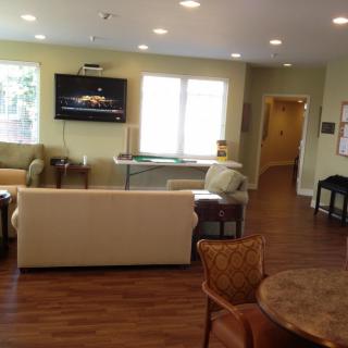 A modern living room with comfortable seating and a television.