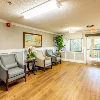 A bright, welcoming waiting room with comfortable seating and tasteful decor.