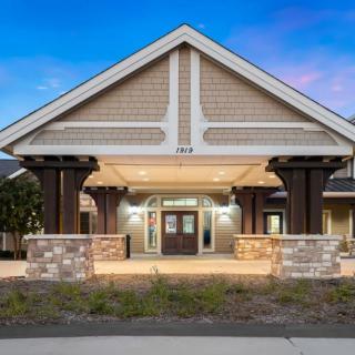 An inviting entrance to a modern building at dusk.