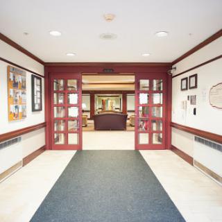 A welcoming hallway leading to an inviting space beyond.