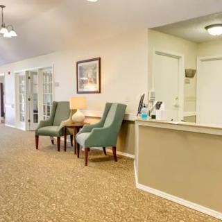 A welcoming reception area with comfortable seating and a front desk.
