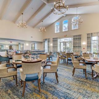A warm and inviting dining area featuring elegant decor and ample seating.