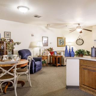A cozy living and dining area with comfortable seating and decorative elements.