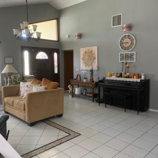 A cozy living room featuring a mix of modern and classic decor elements.