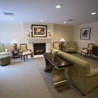 Cozy living room with elegant furniture and a warm fireplace.
