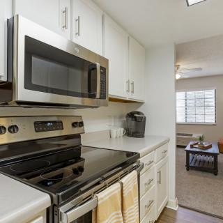 A modern kitchen with stainless steel appliances and sleek countertops.