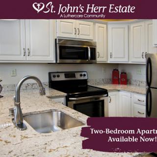 Explore the modern kitchen space of a two-bedroom apartment available at St. John's Herr Estate.