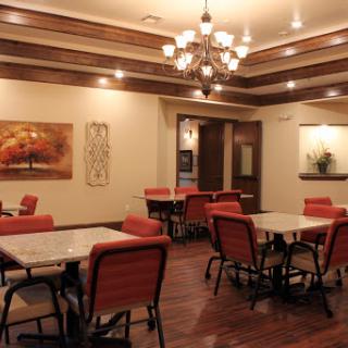 A cozy and well-decorated dining area featuring comfortable seating and ambient lighting.