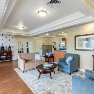 A well-furnished living room with comfortable seating and tasteful decor.