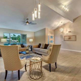 A modern living room with stylish furniture and elegant lighting.