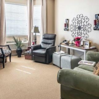 A cozy living room with comfortable seating and elegant decor.