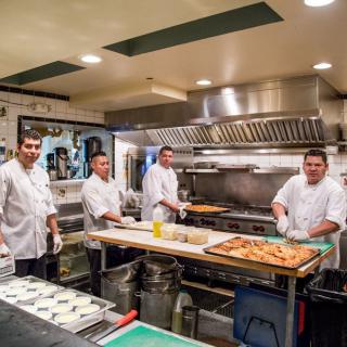 A team of chefs working in a professional kitchen.