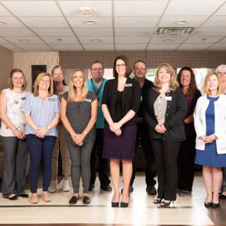 A dedicated team of healthcare professionals posing for a group photo.
