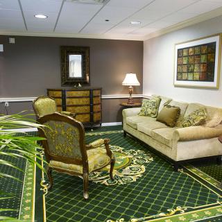 A cozy living room with elegant furniture and decor.