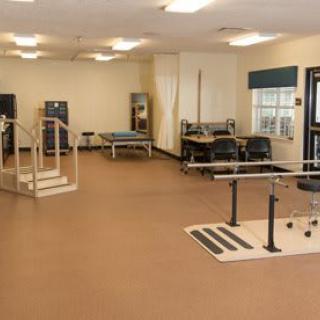 A physical therapy and rehabilitation center with various exercise equipment.