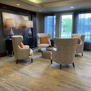 Modern lobby seating area with comfortable chairs and stylish decor.