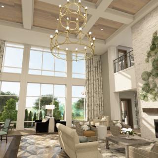 A luxurious living room with high ceilings, a grand chandelier, and large windows overlooking a scenic view.