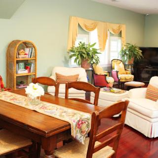 A cozy and inviting living space combining a dining area and comfortable seating.