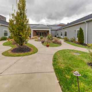A courtyard with pathways and landscaped greenery.