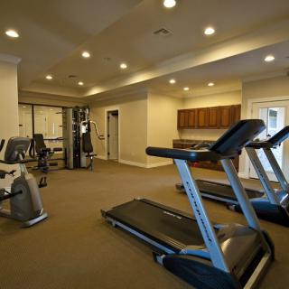 A modern gym interior with treadmills and exercise equipment.