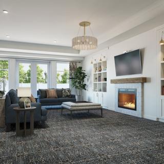 A modern living room featuring a cozy fireplace, stylish furniture, and large windows.