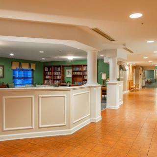 A welcoming reception area with a desk and seating in a well-lit lobby.
