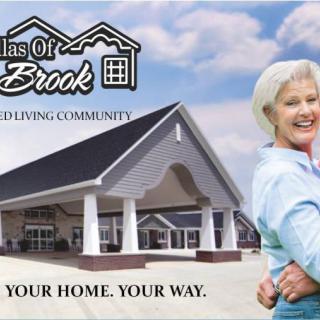 An advertisement for a senior living community, featuring happy elderly residents and the housing complex.