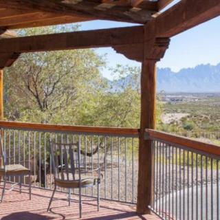 A serene patio overlooking a beautiful mountain landscape.