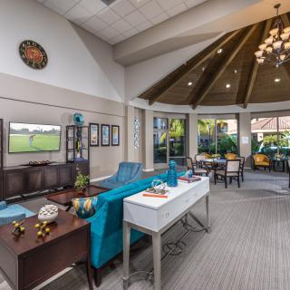 A spacious and modern living room with stylish furniture and abundant natural light.