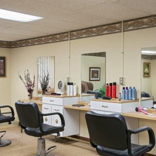 A well-organized hair salon with styling stations and mirrors.