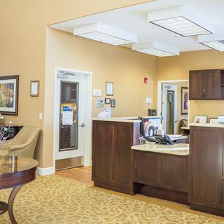 A welcoming reception area with comfortable seating and a desk.