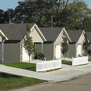 A row of neatly designed houses in a suburban neighborhood.
