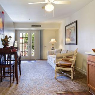 A cozy living room with comfortable furniture and warm lighting.