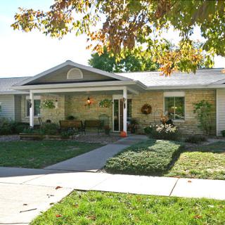 A suburban house with well-maintained landscaping and a welcoming front porch.