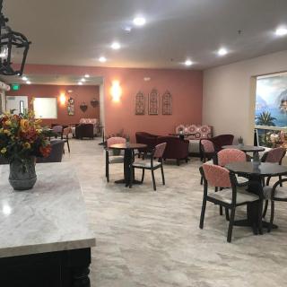 A cozy restaurant interior with neatly arranged tables and chairs.