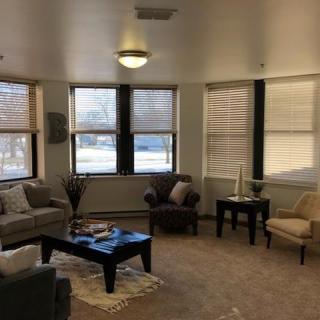 A cozy living room with ample natural light.