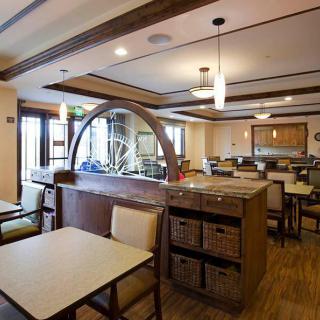 Interior view of a restaurant dining area with tables and chairs.