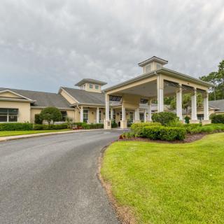 A large building with an elegant entrance and well-maintained landscaping.