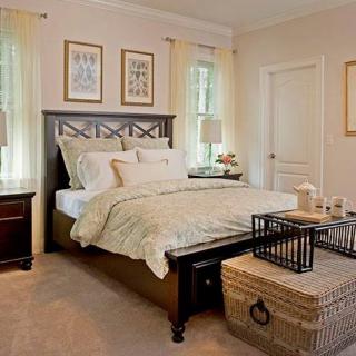 A cozy and elegantly decorated bedroom with a focus on traditional design elements.