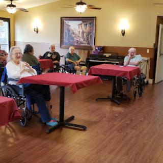 Residents enjoying a social moment in a community room.