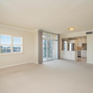 Spacious apartment living room with ample natural light and an open layout.