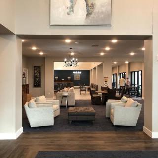 A modern lobby area featuring comfortable seating and elegant decor.