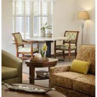 A cozy living room with comfortable seating and natural light.