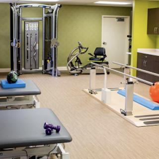 A well-equipped gym designed for rehabilitation and fitness activities.