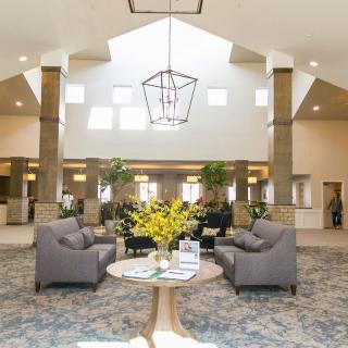 A spacious and well-lit lobby with modern seating and decor.