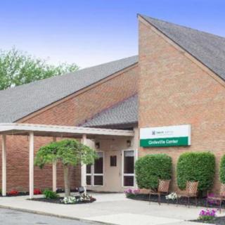 A brick building with a healthcare clinic entrance.