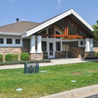 A suburban house with a well-maintained lawn and modern architectural design.
